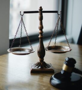 scales and gavel on a desk. credit to Sora Shimazaki